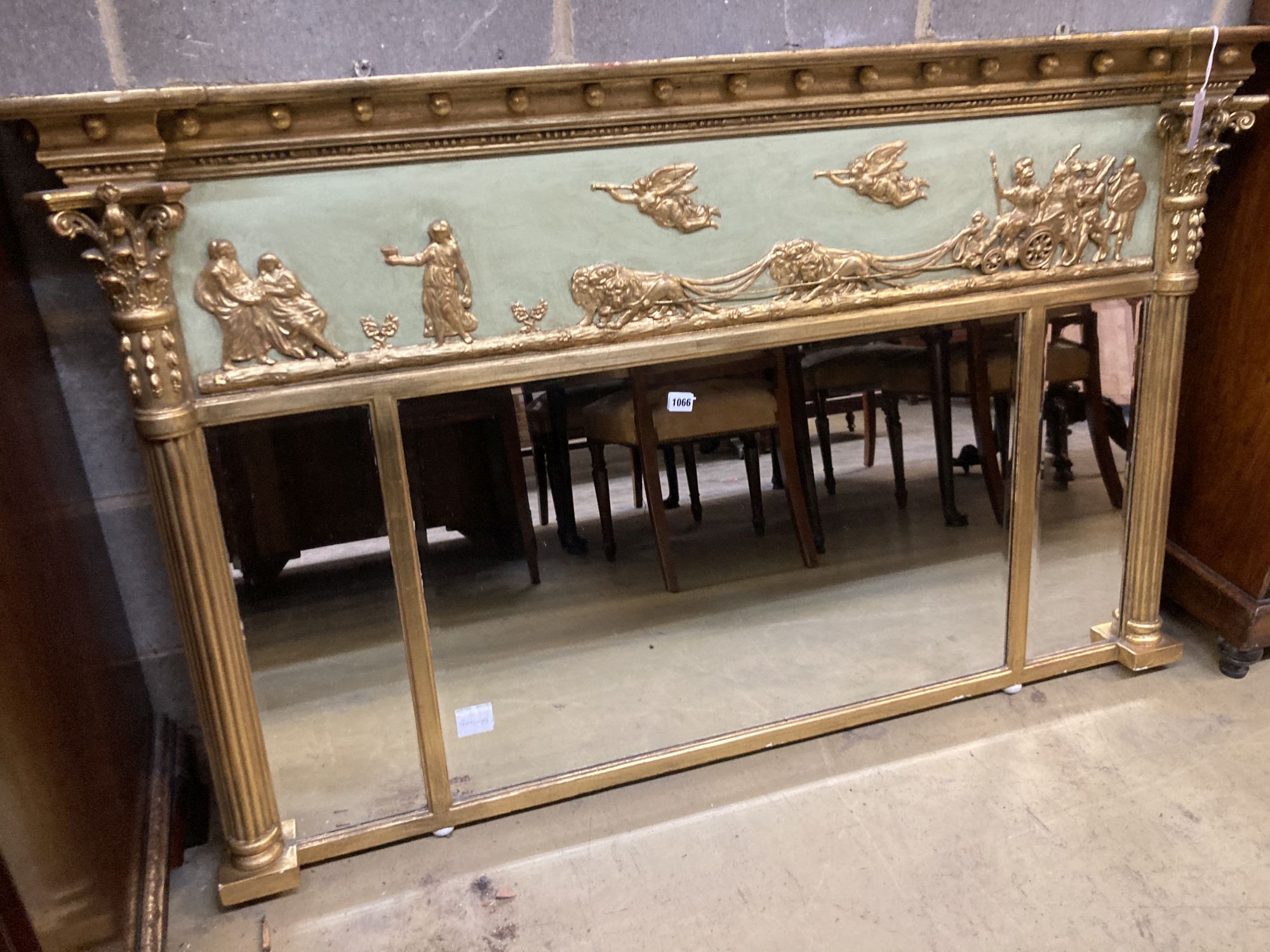 A large Regency carved giltood and gesso triple plate overmantel mirror, width 152cm, height 96cm